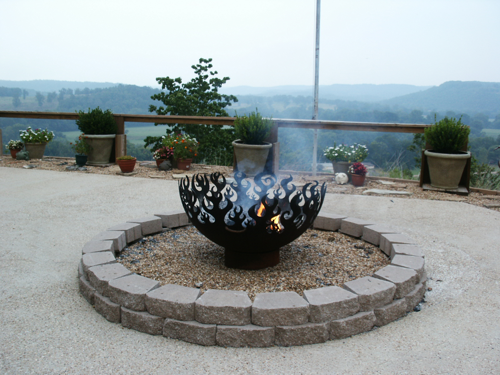 Great Bowl O' Fire 41 Inch Sculptural Firebowl™ overlooking river in Norfolk, AR